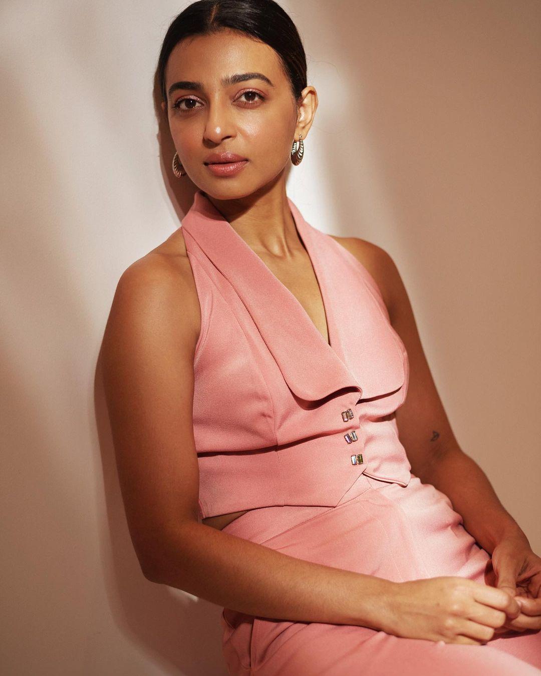 The pastel pink shade adds a soft and feminine touch to her look.&nbsp;